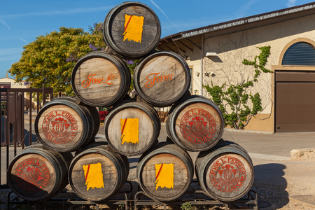 Binissalem , Spain 23 June One of the symbols of Mallorca - Jose Luis Ferrer Three pipes for wine fermentation are standing on the background of vineyard,Pipes for wine fermentationのeditorial素材