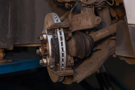 Repair of brake pads on the car. Brake repairの写真素材