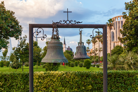 Old black bells on the park background. Old bells.の写真素材