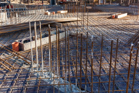 Construction workers fabricating steel reinforcement bar at the construction site.The reinforcement bar was ties together using tiny wire.の写真素材