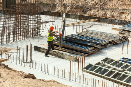 Design of reinforcement cage of reinforcement for concrete frame house, brick house, formwork for concrete pouring, construction site, working crane, construction of housesの写真素材