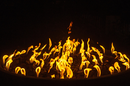 Fire flames on black background, set of lights on a circular surfaceの写真素材