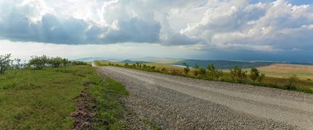 The road to the monastery David Gorenche. Road in the background of green meadows.の写真素材