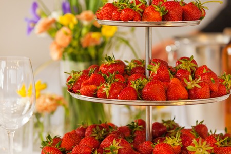 the table is decorated with strawberries.Strawberries on the table.の写真素材