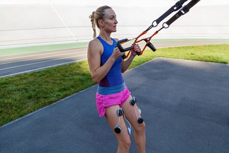 Kiev Ukraine September 21, 2018: Compex pacemaker for fitness. Install electrostimulator on the muscles of the legs. Fitness training with an electrostimulator.のeditorial素材