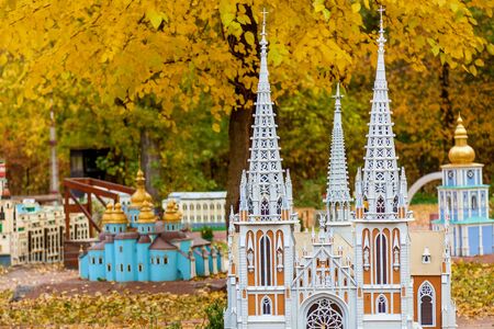 KIEV, UKRAINE October 21, 2018: Model of the St. Nicholas Roman Catholic Cathedral. Autumn amusement park in Kiev, Ukraine in miniature. Sights of Ukraine ancient houses, churches, museums, fortressesのeditorial素材