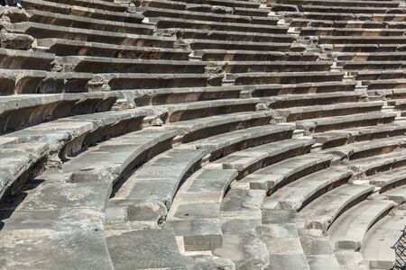 Stone steps of an old amphitheater from ancient times in the region of Antalya, Side, Turkey.の写真素材