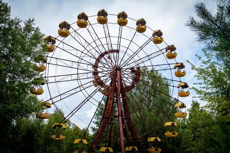 The abandoned Ferris wheel in the amusement park in Pripyat. Chernobyl nuclear power plant zone of alienationの写真素材