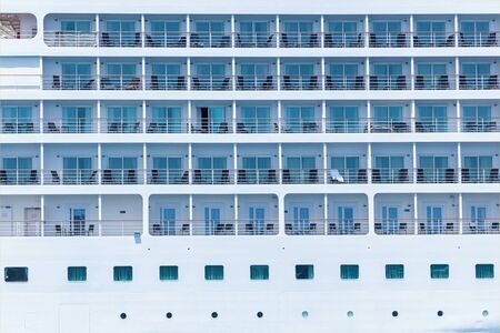 A close-up view of a big passenger cruise ship with specially constructed boats for rescuing...