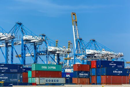 Marsaxlokk, Malta June 17, 2019: A container port and a cargo ship loading plant at the Freeport...