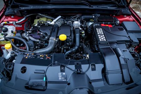 Ukraine Kiev September 24, 2019: An inside view of a red car with new engine details and an...