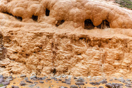Water from the Mineral springs flows through the limestone slope of the mountain next to the Georgian Military Road.の写真素材