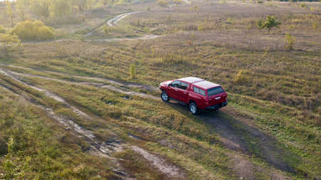 Ukraine Kiev October 10, 2020: Red new 4x4 pickup with Toyota Hilux double cab, with reinforced...