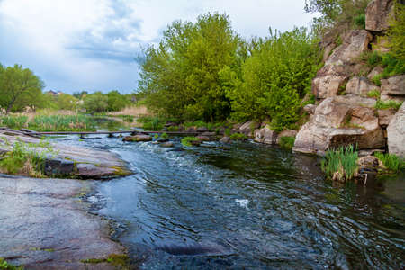 Boguslavsky granite canyon, Ukraine. Rapid flow of the Ros river near granite rocks. Sights and...