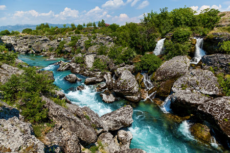 Big and fast river turning into waterfall in Podgorica. Landscapes, sights and nature of Montenegro.の写真素材