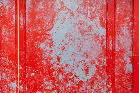 Texture of old painted wooden door of red and blue. background design