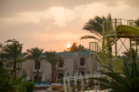 It is very rare in Egypt, in the autumn of the rain. The hotel in Sharm el-Sheikh after a rain. The sun at sunset directly into the lens.の写真素材