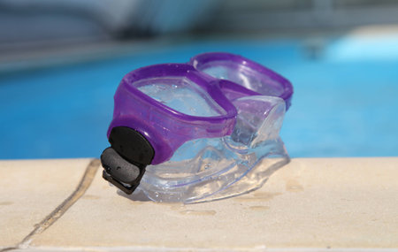 Purple mask on the yellow side of the blue pool.の写真素材