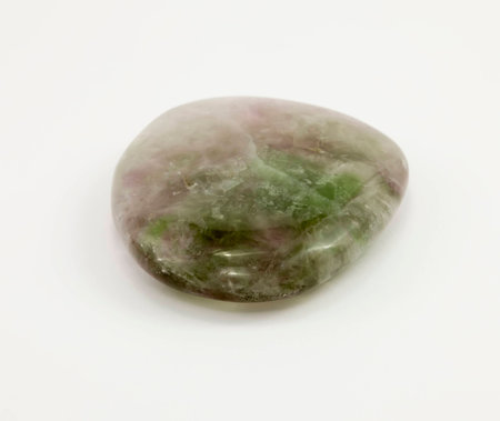 Fluorite, gemstone green and red color on a white background.の写真素材