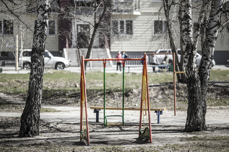 Childrens swing in the summer in the yardの写真素材