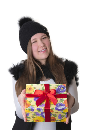 girl in hat winking with a giftの写真素材