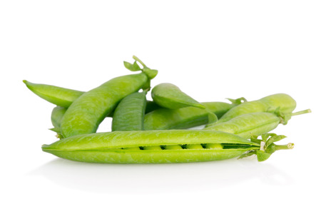 fresh green peas isolatedの写真素材