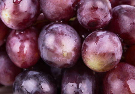 background with pink grapes with dewの写真素材