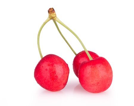 ripe red cherries isolatedの写真素材