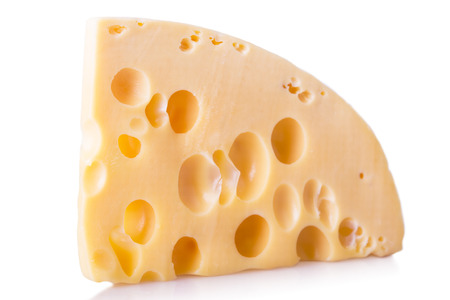 isolated piece of cheeseの写真素材