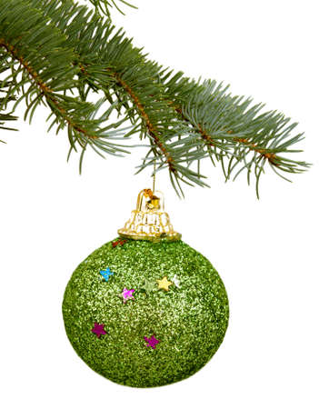 green Christmas toy on a branchの写真素材