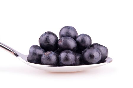 blueberries on spoon isolatedの写真素材