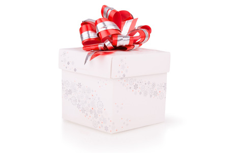 Christmas gift with red bow isolatedの写真素材