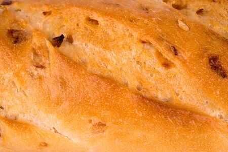 background of golden fresh crispy bread crustの写真素材