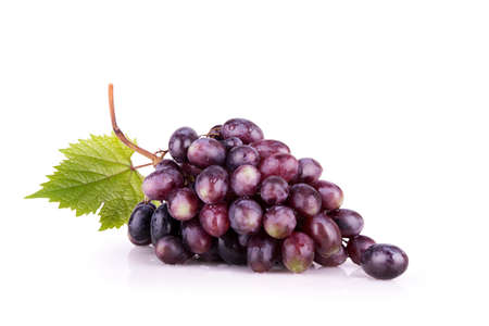 ripe red grapes with leavesの写真素材