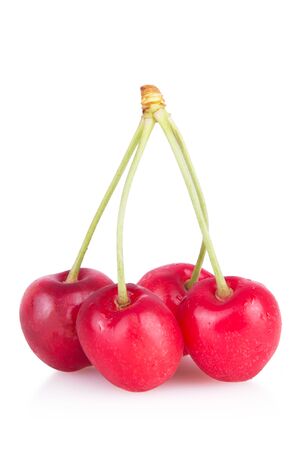 few ripe red cherries isolatedの写真素材