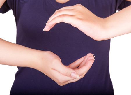 girl shows gesture of protectionの写真素材