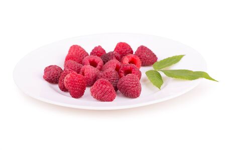 raspberries on a white plate isolatedの写真素材
