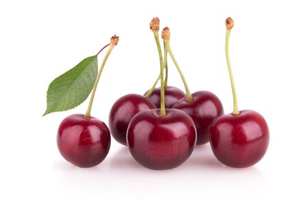 Group of ripe red cherries on white backgroundの写真素材