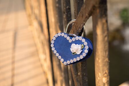 blue love lock on the bridgeの写真素材