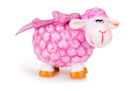 festive pink toy sheep on white backgroundの写真素材