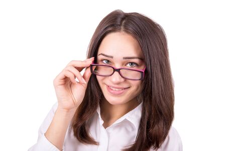 young pretty business woman looking over glassesの写真素材