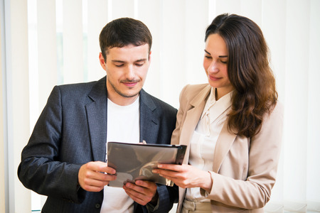 Young business people discuss business plan in the officeの写真素材