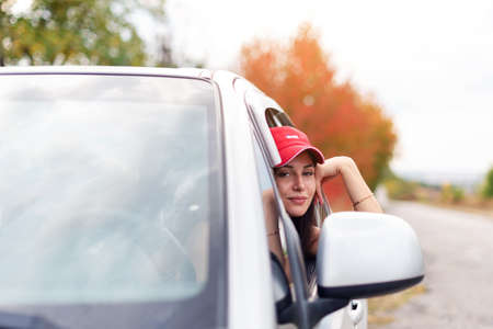 Cheerful sports girl near mountain bike ready for adventure
