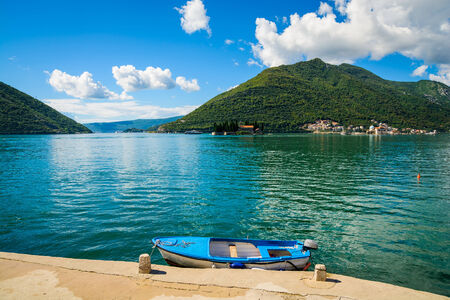 Harbour and boat at Boka Kotor bay (Boka Kotorska), Montenegro, Europe.の写真素材