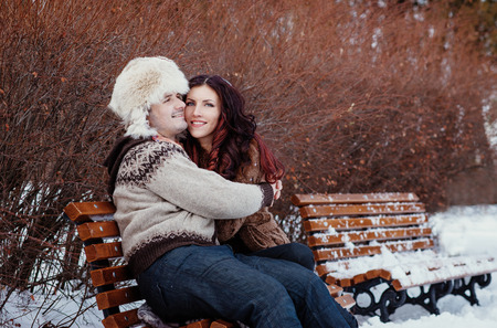 Outdoor fashion portrait of young sensual couple in cold winter weather. Love and kiss.の写真素材