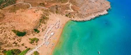 Aerial birds eye view drone photo Agia Agathi beach near Feraklos castle on Rhodes island, Dodecanese, Greece. Panorama with sand beach and clear blue water. Famous tourist destination in South Europeの写真素材