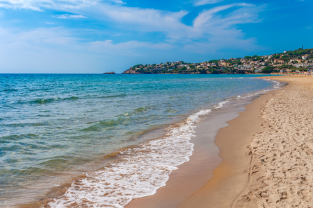 Sea landscape with Sperlonga, Lazio, Italy. Scenic resort town village with nice sand beach and clear blue water in picturesque bay. Famous tourist destination in Riviera de Ulisseの写真素材