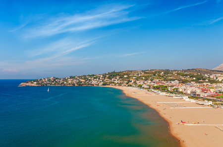 Panoramic sea landscape with Gaeta, Lazio, Italy. Scenic historical town with old buildings, ancient churches, nice sand beach and clear blue water. Famous tourist destination in Riviera de Ulisseの写真素材