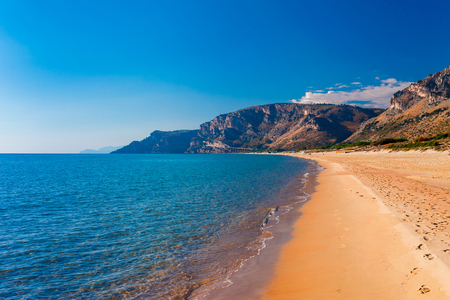 Panoramic sea beach landscape near Gaeta, Lazio, Italy. Nice sand beach and clear blue water. Famous tourist destination in Riviera de Ulisse. Bright sunny light and sunset.の写真素材