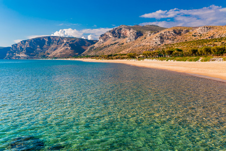Panoramic sea beach landscape near Gaeta, Lazio, Italy. Nice sand beach and clear blue water. Famous tourist destination in Riviera de Ulisse. Bright sunny light and sunset.の写真素材
